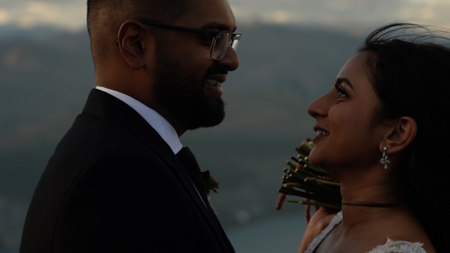 Bride and Groom crying on mountain
