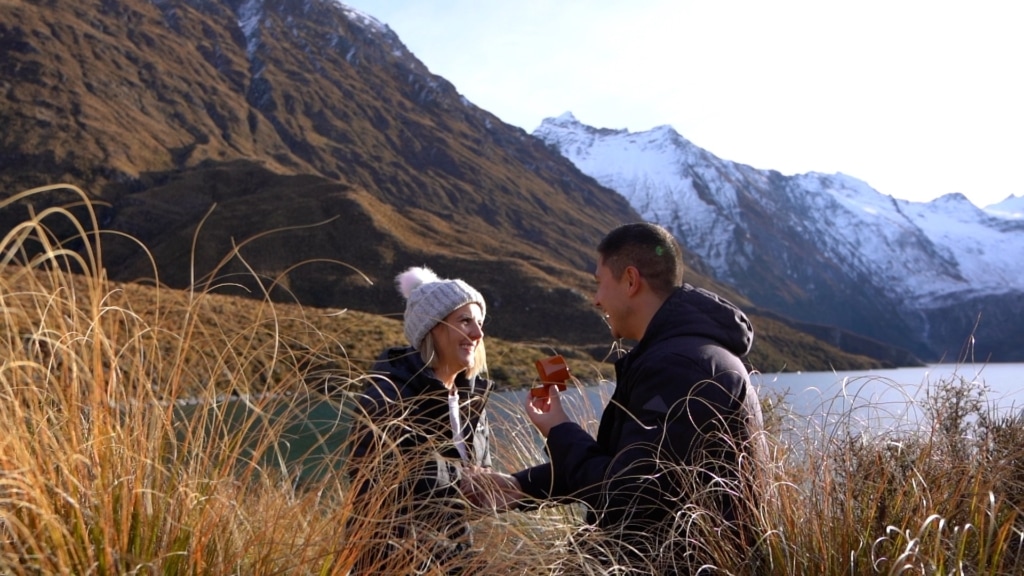 Man proposes to fiance next to lake