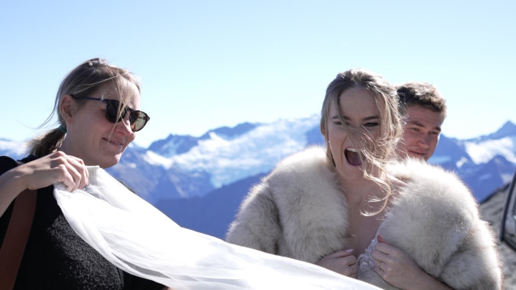 Bride laughing on mountain